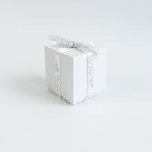 Load image into Gallery viewer, Picture of a white gift box finished with MJM Home Fragrance branded ribbon
